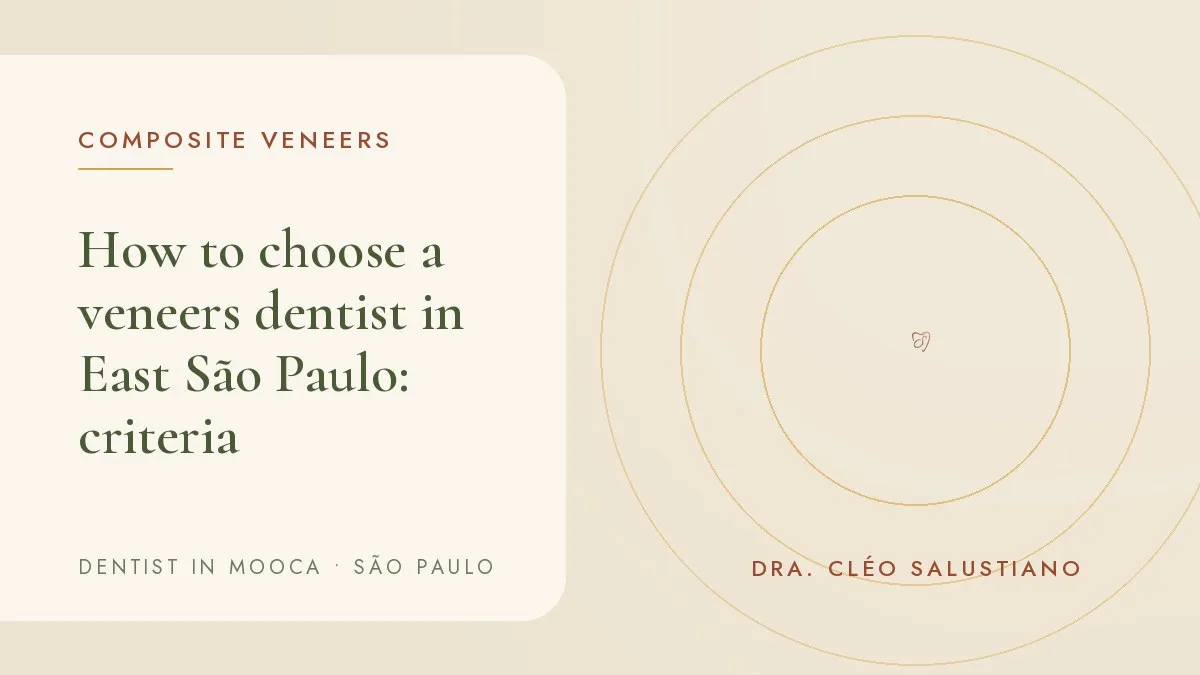 Patient talking with the dentist about a veneers plan in a bright dental office — cover of the article 'How to choose a veneers dentist in East São Paulo', from a dental office in Mooca, São Paulo.