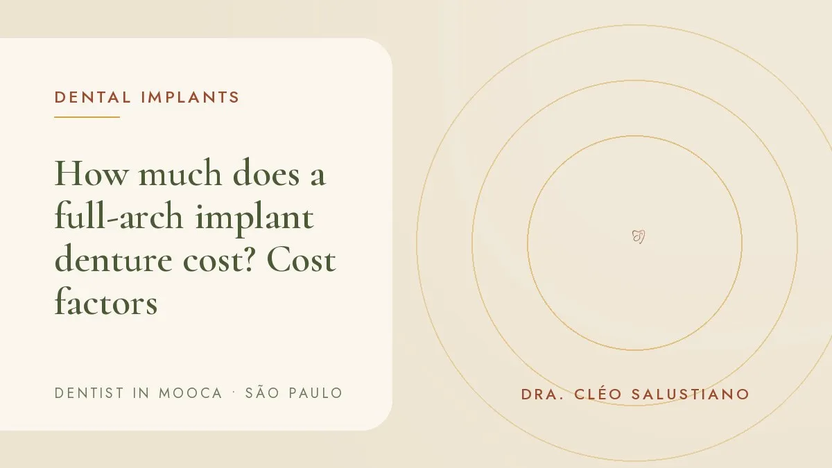 Model of a full-arch implant denture on a light surface — cover of the article 'How much does a full-arch implant denture cost?', from the office of Dr. Cléo Salustiano, dentist in Mooca, São Paulo.